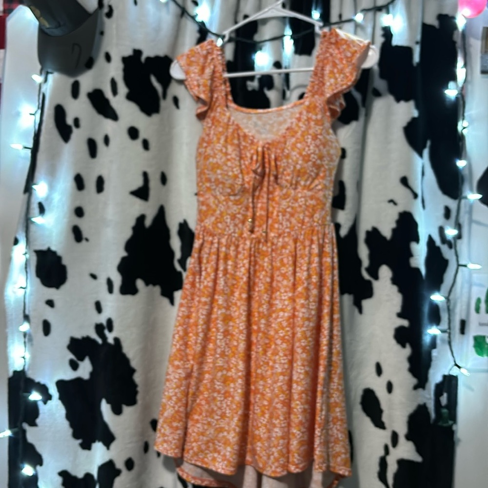 A floral low back high front spring dress